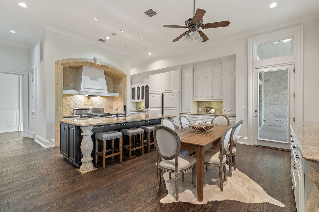 208 Bella Riva Drive, Austin, Texas seated on a well-manicured acre lot with complete privacy and lake views in the coveted gated community of Costa Bella on Lake Travis boasting timeless, high-quality craftsmanship abounds in every corner.