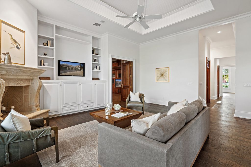 208 Bella Riva Drive, Austin, Texas seated on a well-manicured acre lot with complete privacy and lake views in the coveted gated community of Costa Bella on Lake Travis boasting timeless, high-quality craftsmanship abounds in every corner.