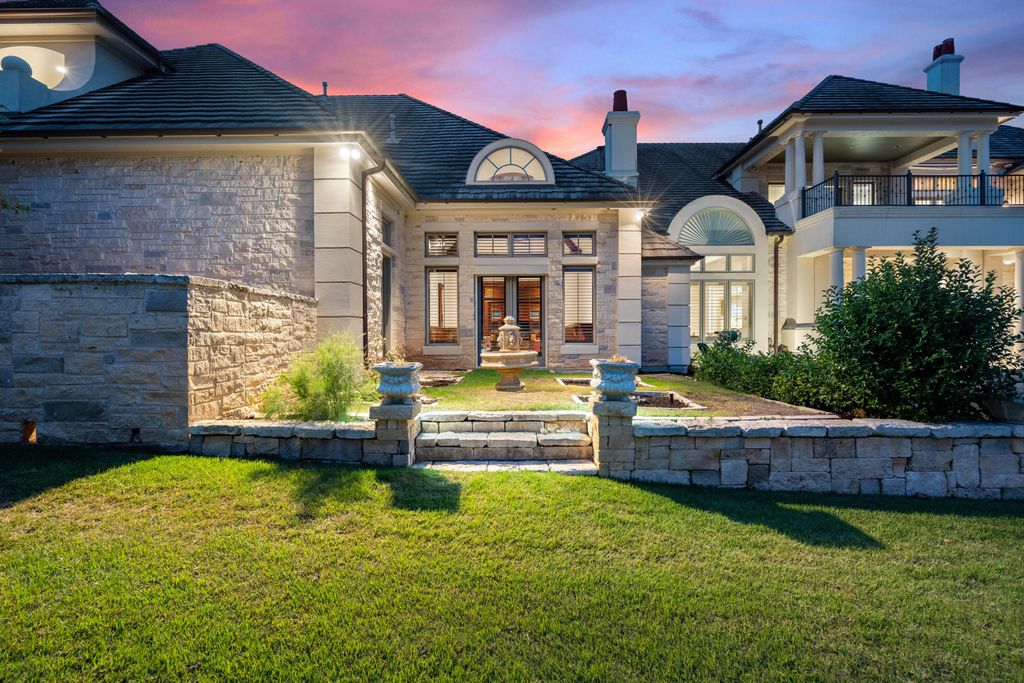 208 Bella Riva Drive, Austin, Texas seated on a well-manicured acre lot with complete privacy and lake views in the coveted gated community of Costa Bella on Lake Travis boasting timeless, high-quality craftsmanship abounds in every corner.