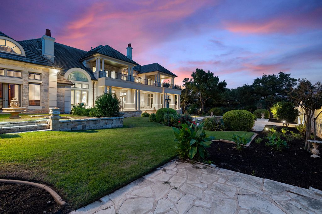 208 Bella Riva Drive, Austin, Texas seated on a well-manicured acre lot with complete privacy and lake views in the coveted gated community of Costa Bella on Lake Travis boasting timeless, high-quality craftsmanship abounds in every corner.