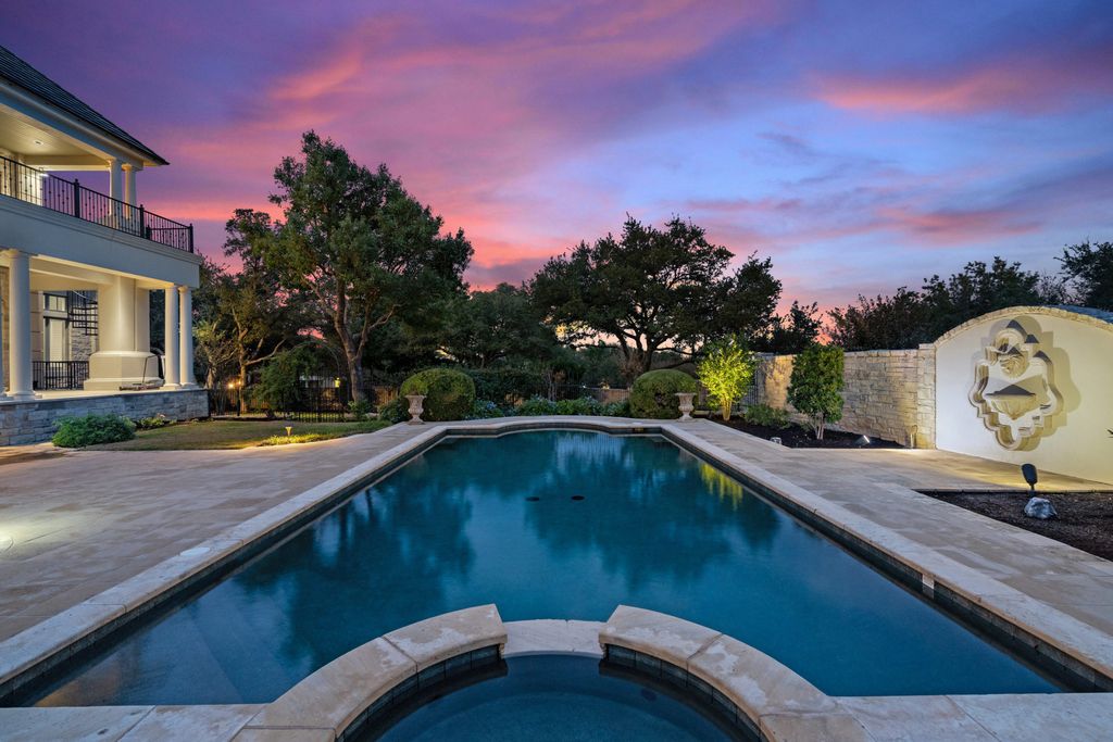 208 Bella Riva Drive, Austin, Texas seated on a well-manicured acre lot with complete privacy and lake views in the coveted gated community of Costa Bella on Lake Travis boasting timeless, high-quality craftsmanship abounds in every corner.