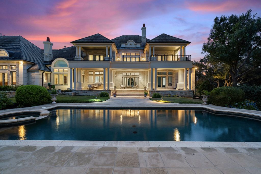 208 Bella Riva Drive, Austin, Texas seated on a well-manicured acre lot with complete privacy and lake views in the coveted gated community of Costa Bella on Lake Travis boasting timeless, high-quality craftsmanship abounds in every corner.