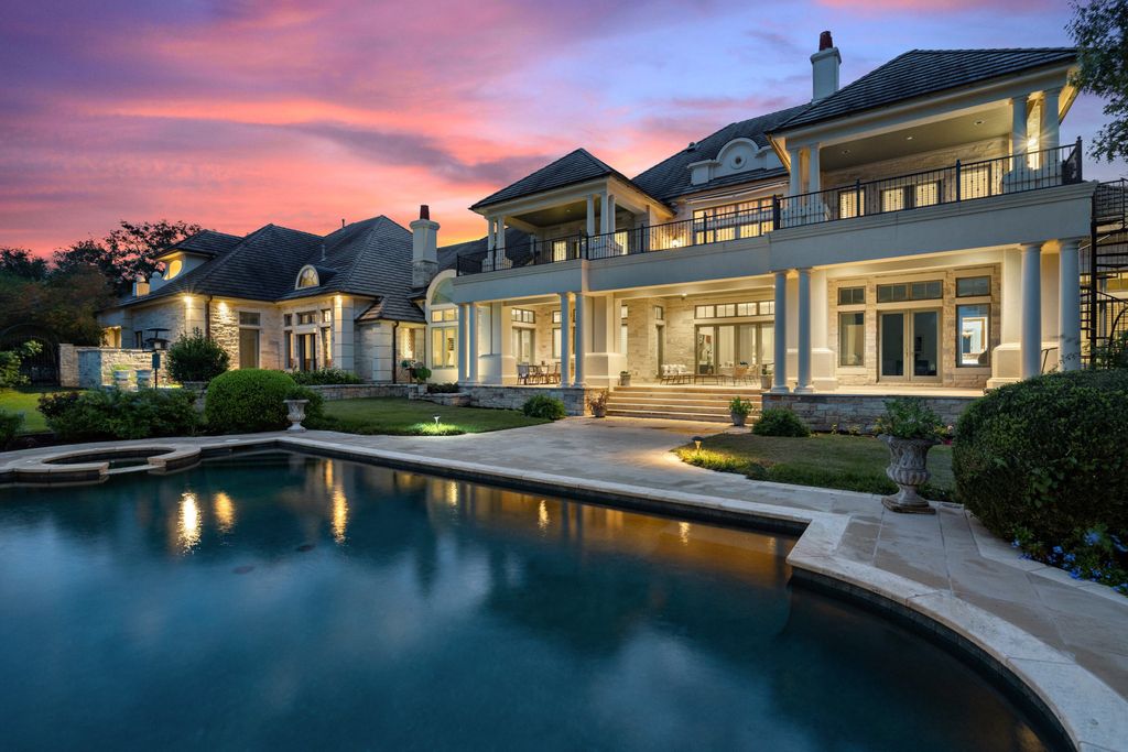 208 Bella Riva Drive, Austin, Texas seated on a well-manicured acre lot with complete privacy and lake views in the coveted gated community of Costa Bella on Lake Travis boasting timeless, high-quality craftsmanship abounds in every corner.