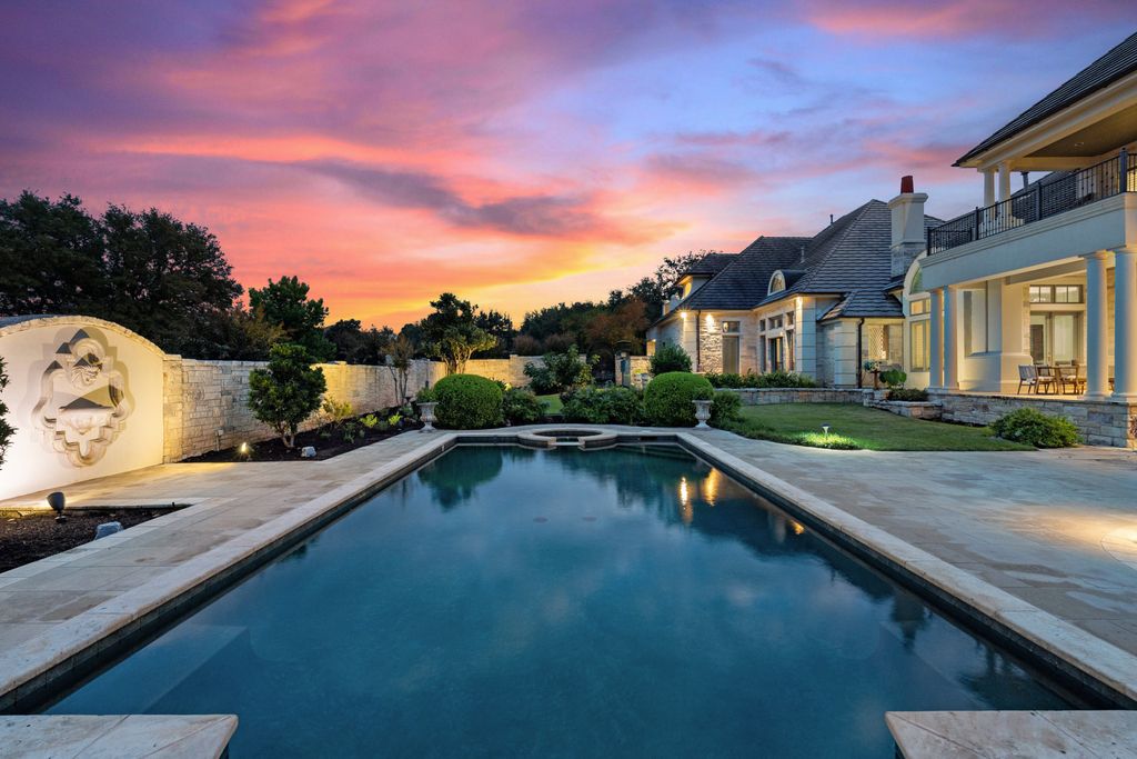 208 Bella Riva Drive, Austin, Texas seated on a well-manicured acre lot with complete privacy and lake views in the coveted gated community of Costa Bella on Lake Travis boasting timeless, high-quality craftsmanship abounds in every corner.