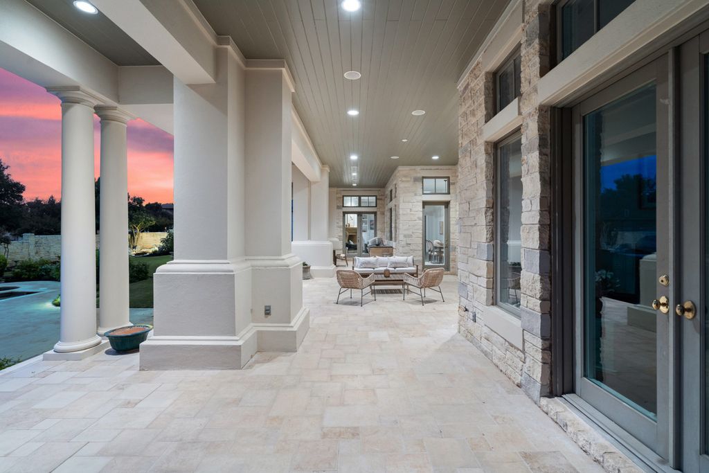 208 Bella Riva Drive, Austin, Texas seated on a well-manicured acre lot with complete privacy and lake views in the coveted gated community of Costa Bella on Lake Travis boasting timeless, high-quality craftsmanship abounds in every corner.