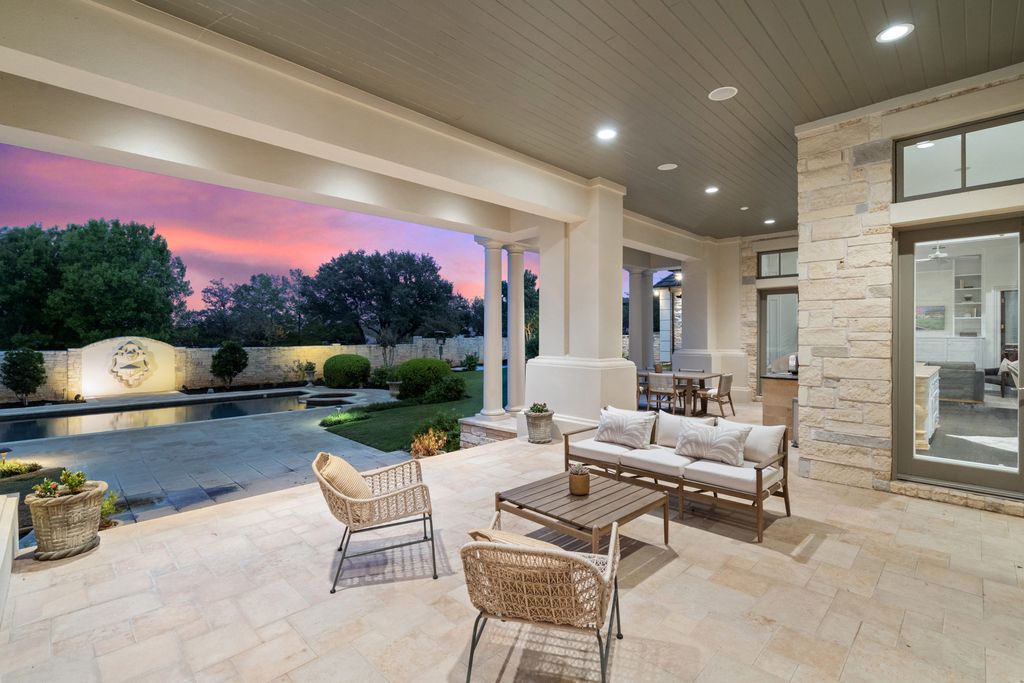 208 Bella Riva Drive, Austin, Texas seated on a well-manicured acre lot with complete privacy and lake views in the coveted gated community of Costa Bella on Lake Travis boasting timeless, high-quality craftsmanship abounds in every corner.
