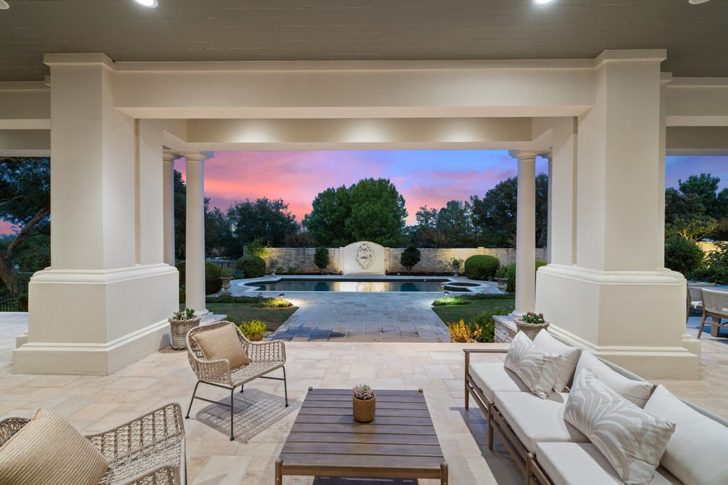 208 Bella Riva Drive, Austin, Texas seated on a well-manicured acre lot with complete privacy and lake views in the coveted gated community of Costa Bella on Lake Travis boasting timeless, high-quality craftsmanship abounds in every corner.