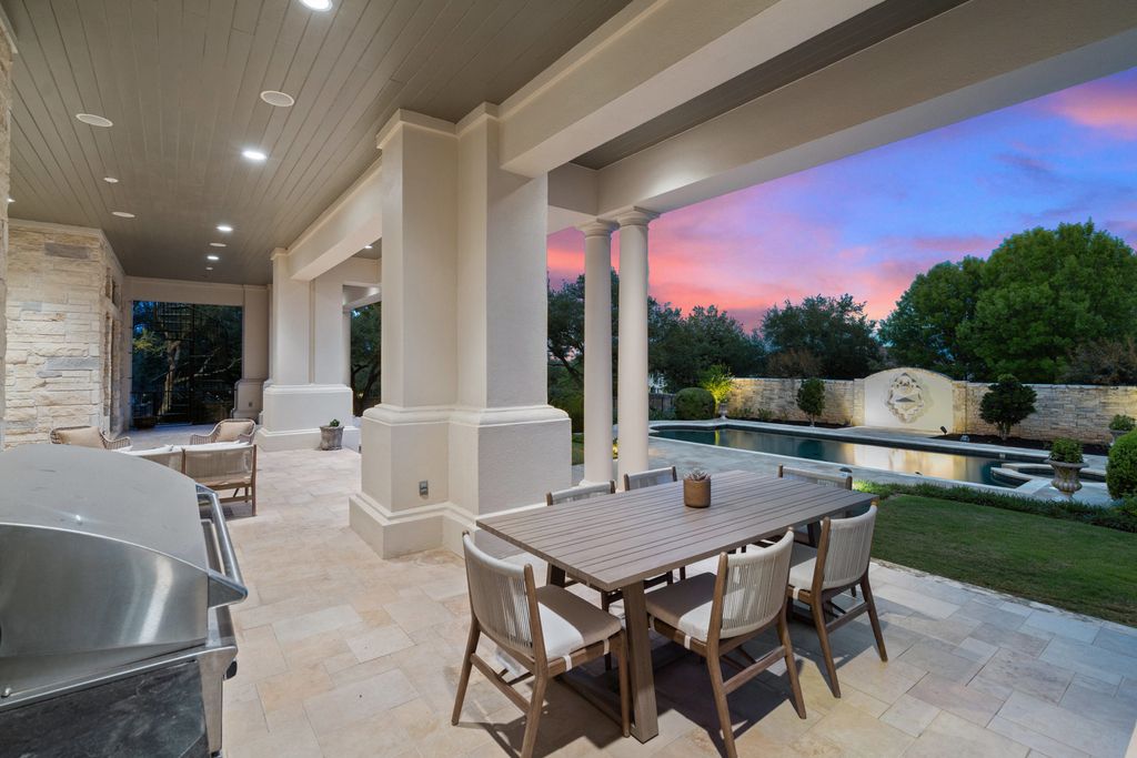 208 Bella Riva Drive, Austin, Texas seated on a well-manicured acre lot with complete privacy and lake views in the coveted gated community of Costa Bella on Lake Travis boasting timeless, high-quality craftsmanship abounds in every corner.