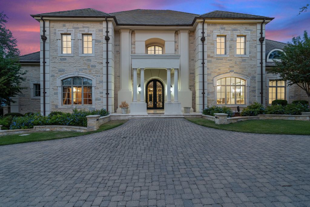208 Bella Riva Drive, Austin, Texas seated on a well-manicured acre lot with complete privacy and lake views in the coveted gated community of Costa Bella on Lake Travis boasting timeless, high-quality craftsmanship abounds in every corner.