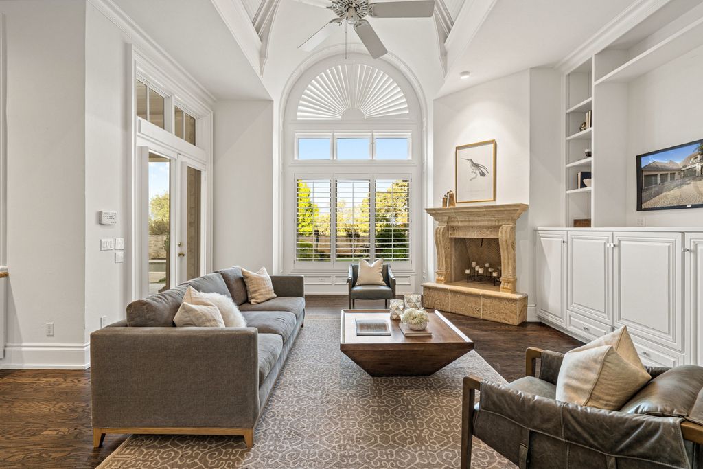 208 Bella Riva Drive, Austin, Texas seated on a well-manicured acre lot with complete privacy and lake views in the coveted gated community of Costa Bella on Lake Travis boasting timeless, high-quality craftsmanship abounds in every corner.