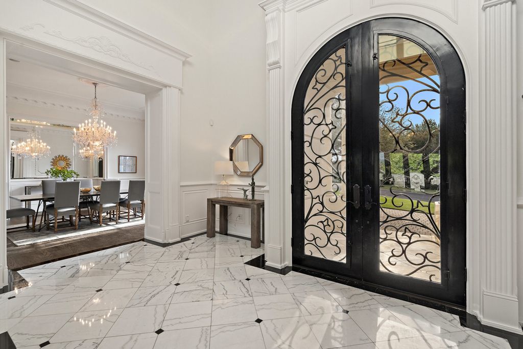 208 Bella Riva Drive, Austin, Texas seated on a well-manicured acre lot with complete privacy and lake views in the coveted gated community of Costa Bella on Lake Travis boasting timeless, high-quality craftsmanship abounds in every corner.