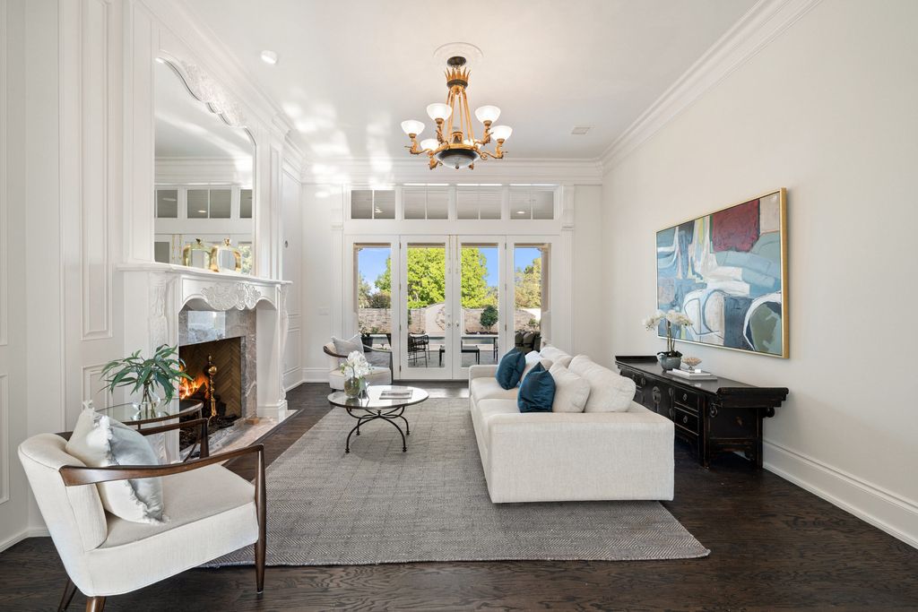 208 Bella Riva Drive, Austin, Texas seated on a well-manicured acre lot with complete privacy and lake views in the coveted gated community of Costa Bella on Lake Travis boasting timeless, high-quality craftsmanship abounds in every corner.