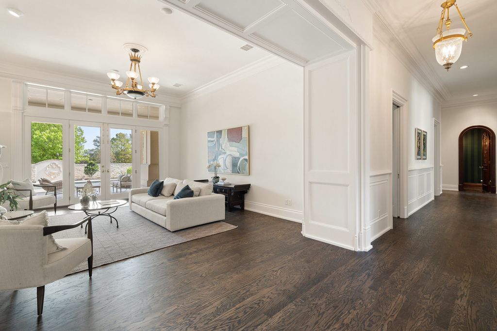 208 Bella Riva Drive, Austin, Texas seated on a well-manicured acre lot with complete privacy and lake views in the coveted gated community of Costa Bella on Lake Travis boasting timeless, high-quality craftsmanship abounds in every corner.
