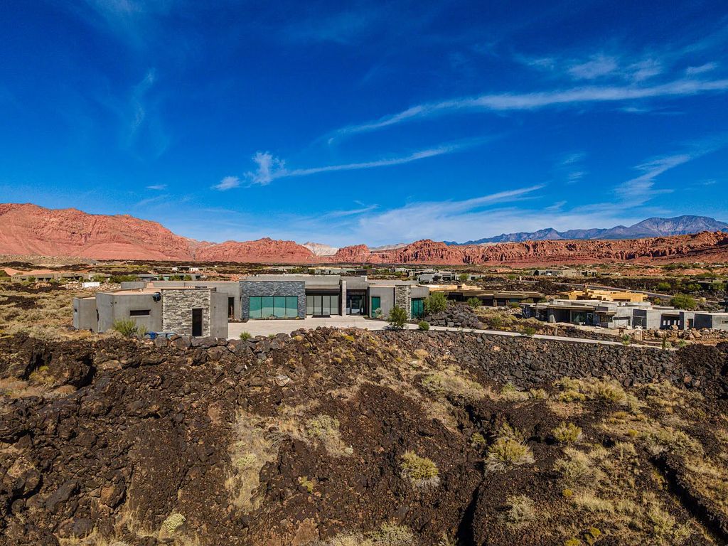 2399 N Kiva Trail, Saint George, Utah is a truly one of a kind contemporary estate sits 28 feet above the street below, boasts 360 degree views, including a picture perfect framing of Snow Canyon, Red Mountain, Pine Valley Mountain, Movie Rock, and the Kachina Cliffs.