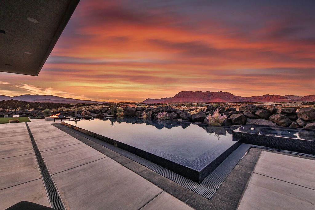 2399 N Kiva Trail, Saint George, Utah is a truly one of a kind contemporary estate sits 28 feet above the street below, boasts 360 degree views, including a picture perfect framing of Snow Canyon, Red Mountain, Pine Valley Mountain, Movie Rock, and the Kachina Cliffs.