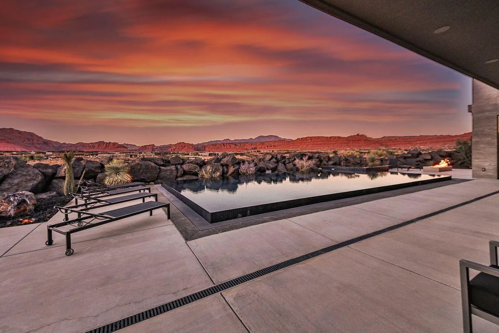 2399 N Kiva Trail, Saint George, Utah is a truly one of a kind contemporary estate sits 28 feet above the street below, boasts 360 degree views, including a picture perfect framing of Snow Canyon, Red Mountain, Pine Valley Mountain, Movie Rock, and the Kachina Cliffs.