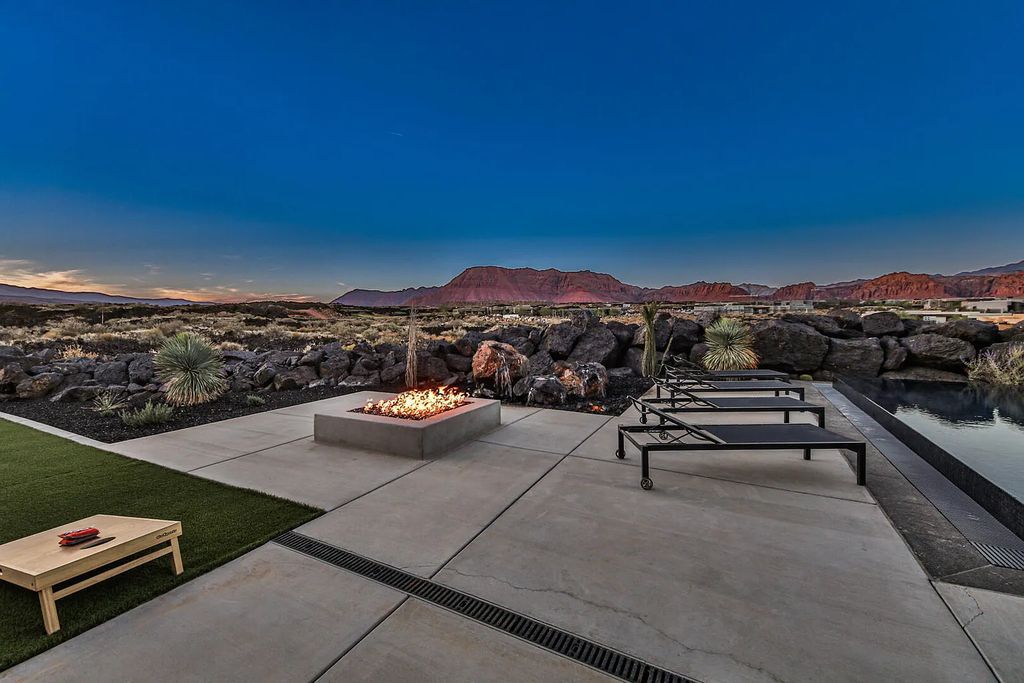 2399 N Kiva Trail, Saint George, Utah is a truly one of a kind contemporary estate sits 28 feet above the street below, boasts 360 degree views, including a picture perfect framing of Snow Canyon, Red Mountain, Pine Valley Mountain, Movie Rock, and the Kachina Cliffs.