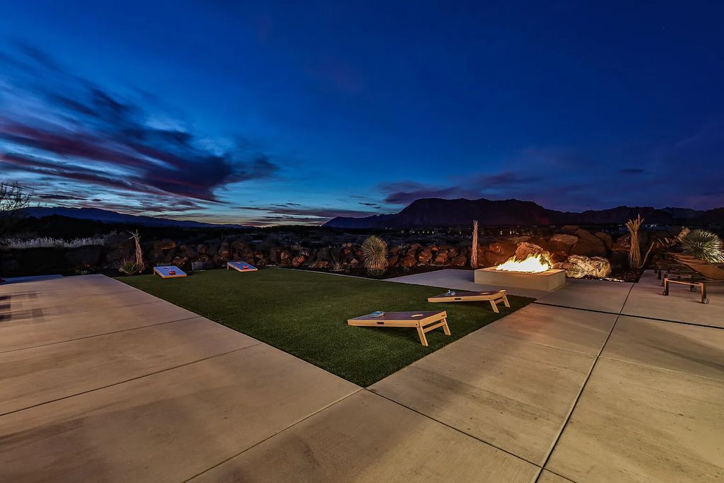 2399 N Kiva Trail, Saint George, Utah is a truly one of a kind contemporary estate sits 28 feet above the street below, boasts 360 degree views, including a picture perfect framing of Snow Canyon, Red Mountain, Pine Valley Mountain, Movie Rock, and the Kachina Cliffs.
