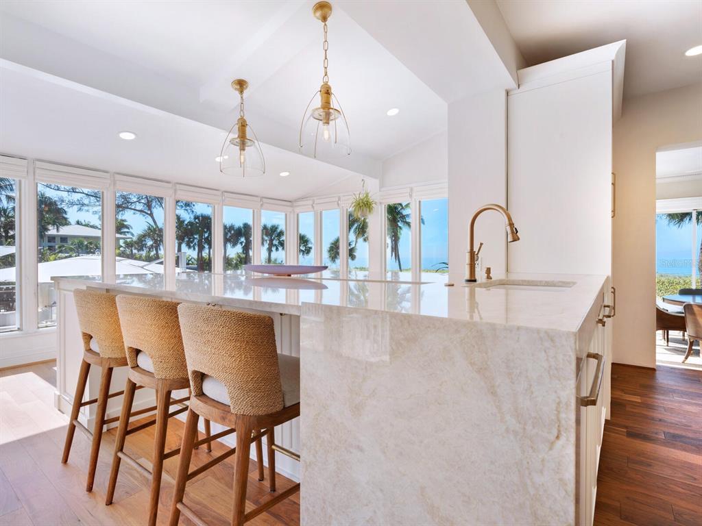 8218 Sanderling Rd, Sarasota, Florida is a private resort-like compound with over 300 feet of direct beachfront rests on over 4-acres between the tranquil blue Gulf of Mexico waters and the quiet banks of Heron Lagoon in the Sanderling Club.