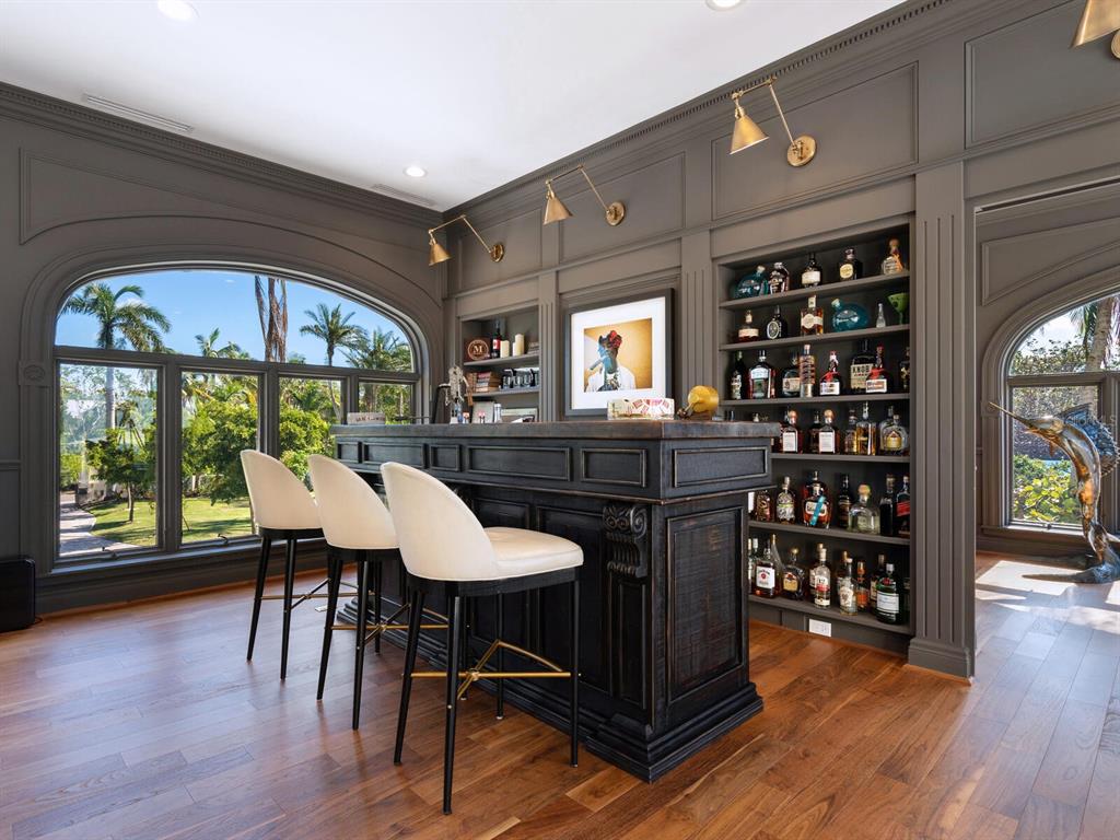 8218 Sanderling Rd, Sarasota, Florida is a private resort-like compound with over 300 feet of direct beachfront rests on over 4-acres between the tranquil blue Gulf of Mexico waters and the quiet banks of Heron Lagoon in the Sanderling Club.