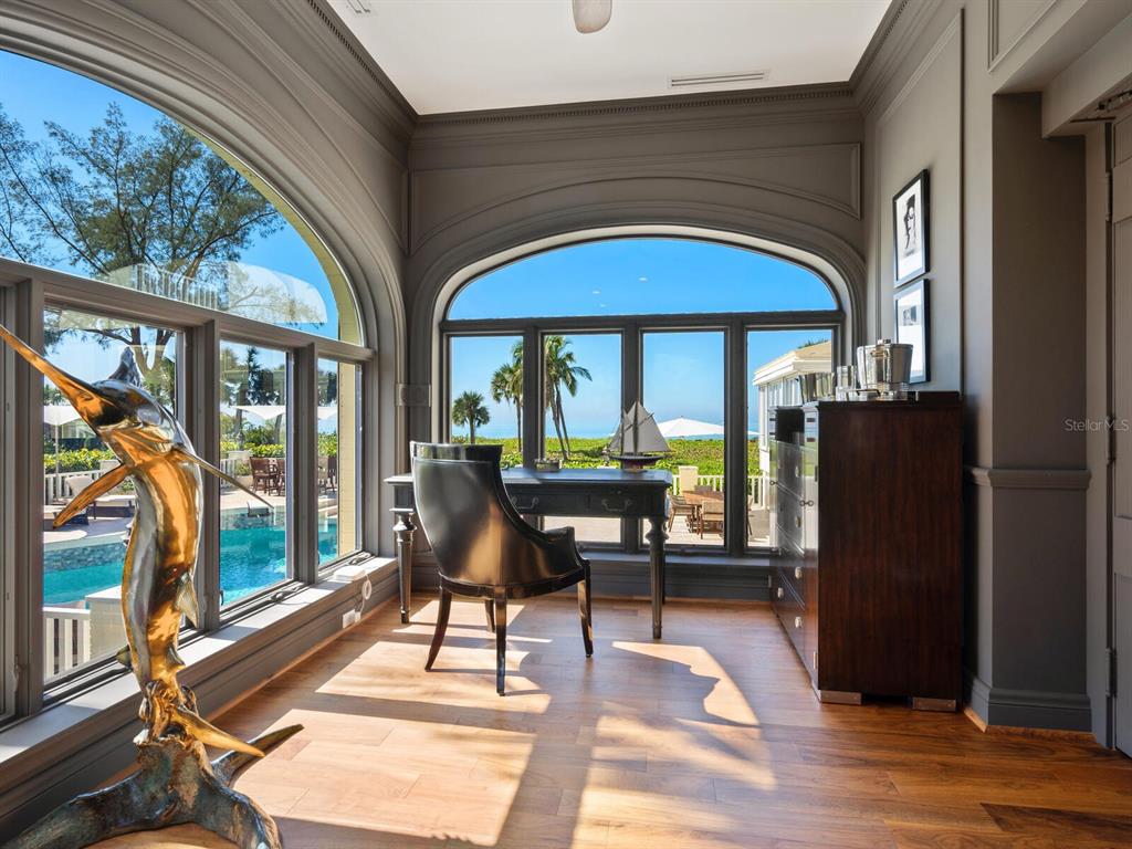 8218 Sanderling Rd, Sarasota, Florida is a private resort-like compound with over 300 feet of direct beachfront rests on over 4-acres between the tranquil blue Gulf of Mexico waters and the quiet banks of Heron Lagoon in the Sanderling Club.
