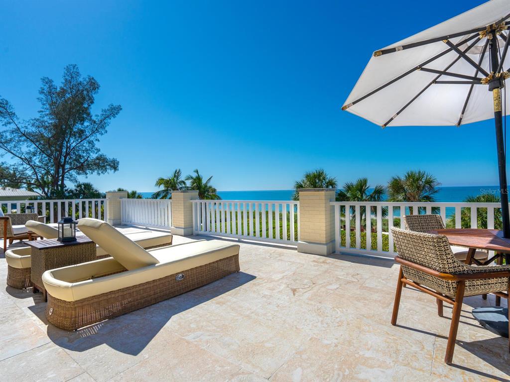 8218 Sanderling Rd, Sarasota, Florida is a private resort-like compound with over 300 feet of direct beachfront rests on over 4-acres between the tranquil blue Gulf of Mexico waters and the quiet banks of Heron Lagoon in the Sanderling Club.