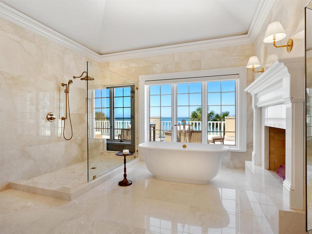 8218 Sanderling Rd, Sarasota, Florida is a private resort-like compound with over 300 feet of direct beachfront rests on over 4-acres between the tranquil blue Gulf of Mexico waters and the quiet banks of Heron Lagoon in the Sanderling Club.