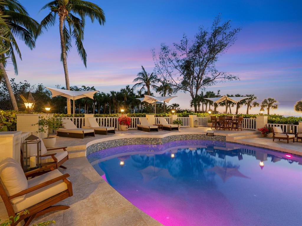 8218 Sanderling Rd, Sarasota, Florida is a private resort-like compound with over 300 feet of direct beachfront rests on over 4-acres between the tranquil blue Gulf of Mexico waters and the quiet banks of Heron Lagoon in the Sanderling Club.