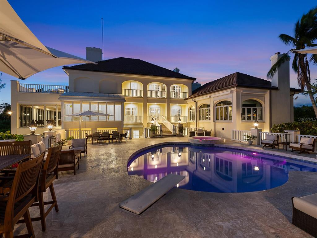 8218 Sanderling Rd, Sarasota, Florida is a private resort-like compound with over 300 feet of direct beachfront rests on over 4-acres between the tranquil blue Gulf of Mexico waters and the quiet banks of Heron Lagoon in the Sanderling Club.