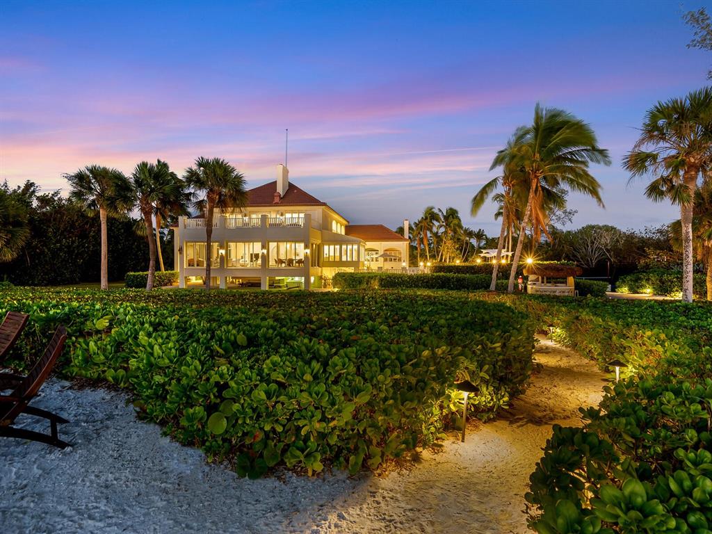 8218 Sanderling Rd, Sarasota, Florida is a private resort-like compound with over 300 feet of direct beachfront rests on over 4-acres between the tranquil blue Gulf of Mexico waters and the quiet banks of Heron Lagoon in the Sanderling Club.