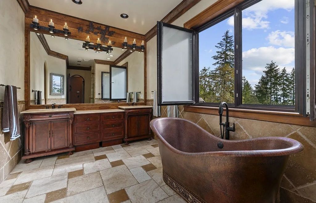 The Estate in Portland is a luxurious home fully furnished with vineyard and underground wine cellar now available for sale. This home located at 14125 NW Germantown Rd, Portland, Oregon; offering 06 bedrooms and 06 bathrooms with 13,000 square feet of living spaces.
