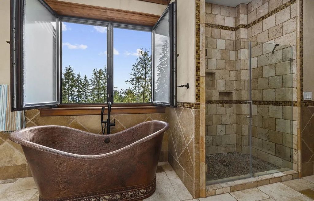 The Estate in Portland is a luxurious home fully furnished with vineyard and underground wine cellar now available for sale. This home located at 14125 NW Germantown Rd, Portland, Oregon; offering 06 bedrooms and 06 bathrooms with 13,000 square feet of living spaces.