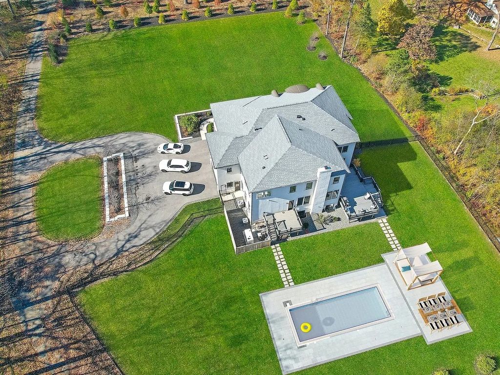 The Estate in Lincolnshire offers a grand scale foyer, ebony oak floors, an open floor plan, soaring ceiling heights, custom luxury finishes throughout now available for sale. This home located at 23477 N Elm Rd, Lincolnshire, Illinois