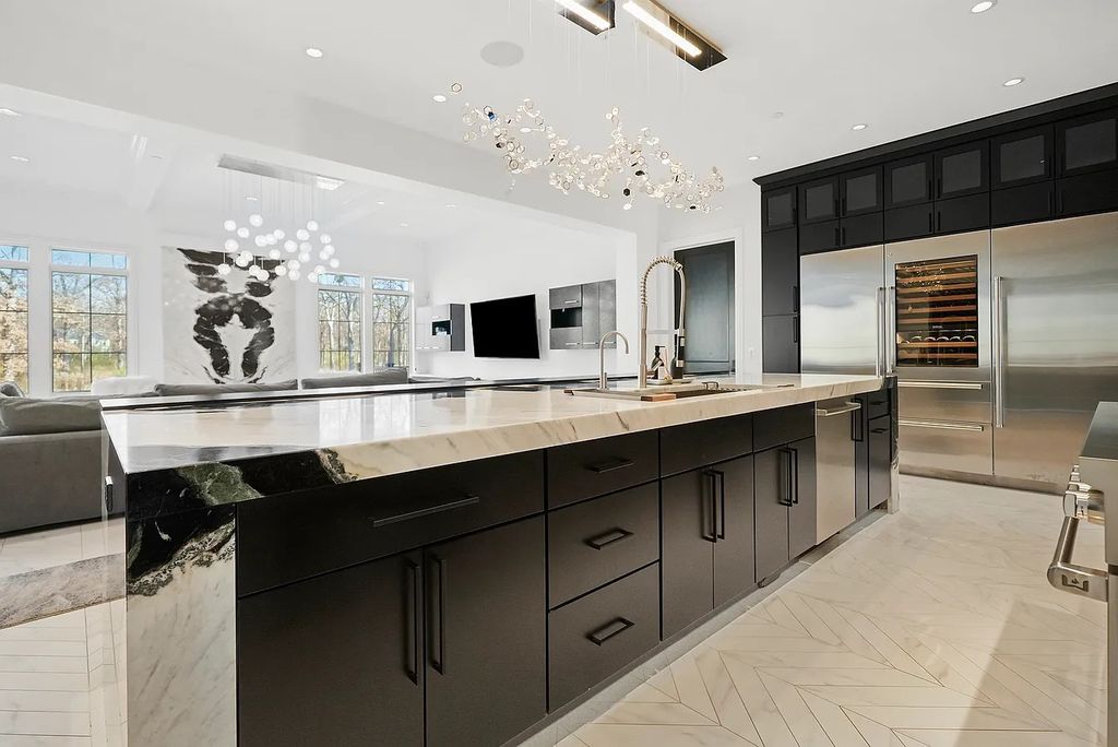The Estate in Lincolnshire offers a grand scale foyer, ebony oak floors, an open floor plan, soaring ceiling heights, custom luxury finishes throughout now available for sale. This home located at 23477 N Elm Rd, Lincolnshire, Illinois