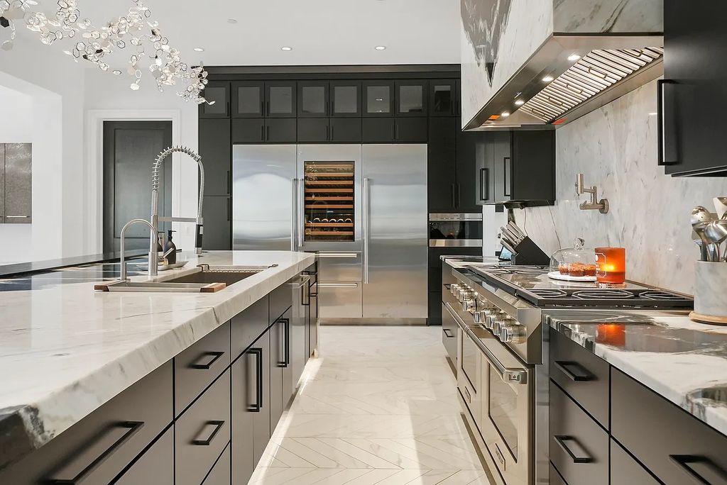 The Estate in Lincolnshire offers a grand scale foyer, ebony oak floors, an open floor plan, soaring ceiling heights, custom luxury finishes throughout now available for sale. This home located at 23477 N Elm Rd, Lincolnshire, Illinois