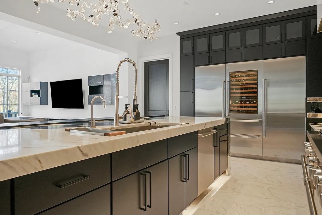 The Estate in Lincolnshire offers a grand scale foyer, ebony oak floors, an open floor plan, soaring ceiling heights, custom luxury finishes throughout now available for sale. This home located at 23477 N Elm Rd, Lincolnshire, Illinois