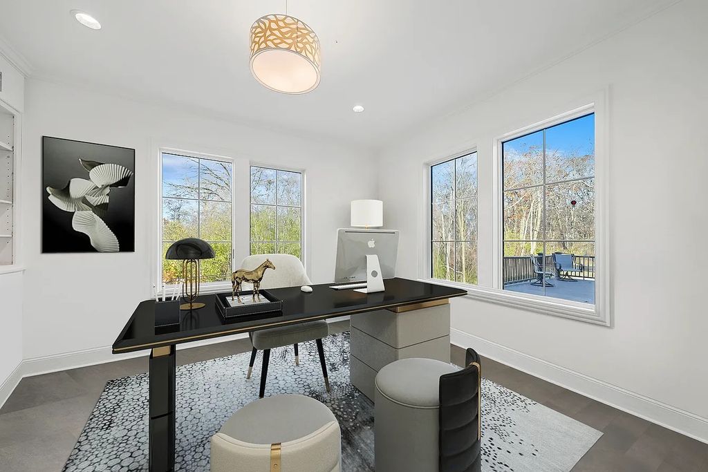 The Estate in Lincolnshire offers a grand scale foyer, ebony oak floors, an open floor plan, soaring ceiling heights, custom luxury finishes throughout now available for sale. This home located at 23477 N Elm Rd, Lincolnshire, Illinois
