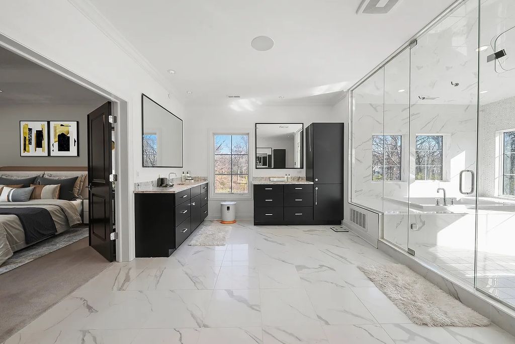 The Estate in Lincolnshire offers a grand scale foyer, ebony oak floors, an open floor plan, soaring ceiling heights, custom luxury finishes throughout now available for sale. This home located at 23477 N Elm Rd, Lincolnshire, Illinois