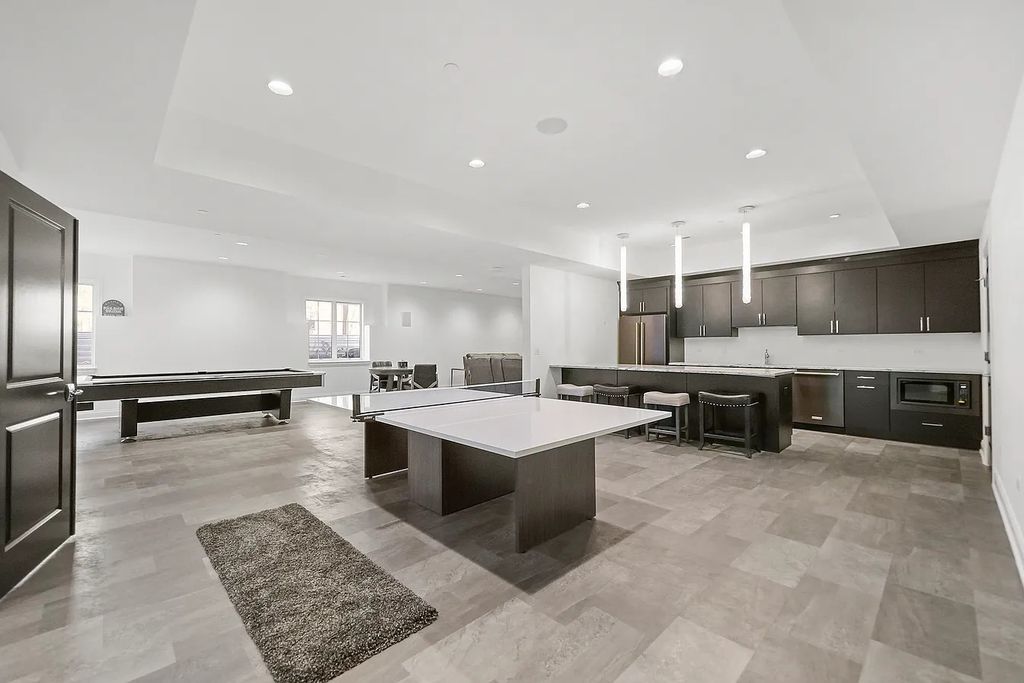 The Estate in Lincolnshire offers a grand scale foyer, ebony oak floors, an open floor plan, soaring ceiling heights, custom luxury finishes throughout now available for sale. This home located at 23477 N Elm Rd, Lincolnshire, Illinois
