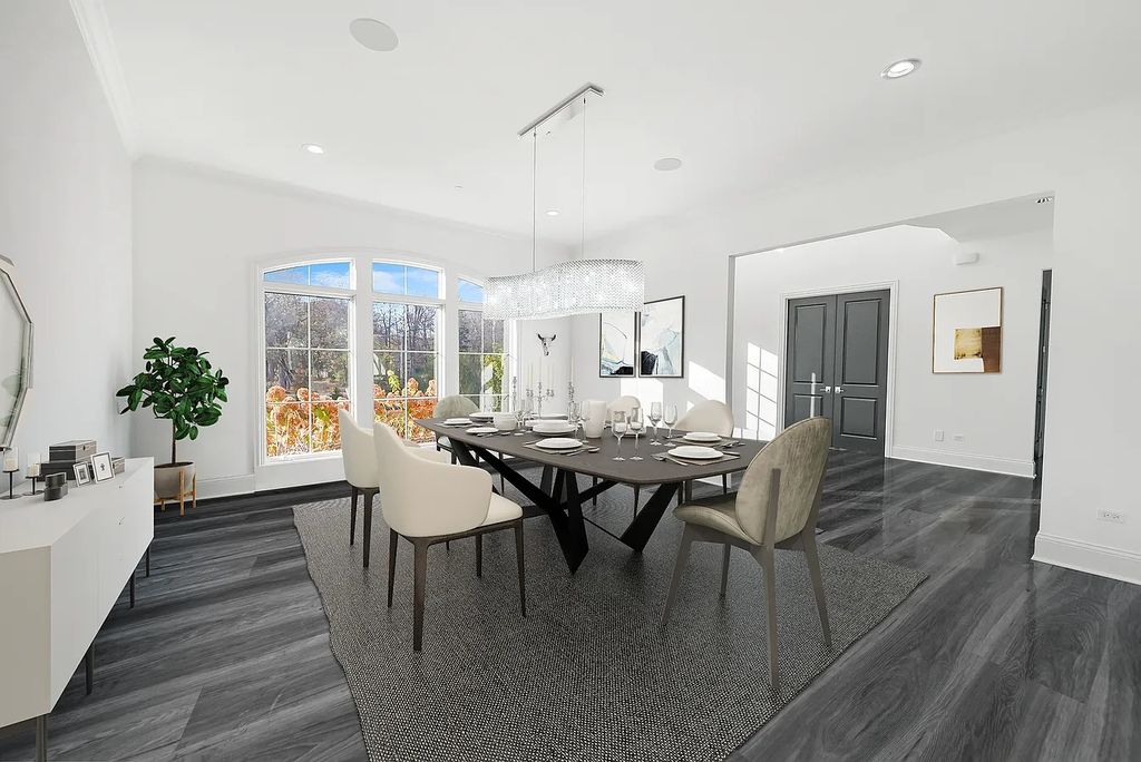 The Estate in Lincolnshire offers a grand scale foyer, ebony oak floors, an open floor plan, soaring ceiling heights, custom luxury finishes throughout now available for sale. This home located at 23477 N Elm Rd, Lincolnshire, Illinois