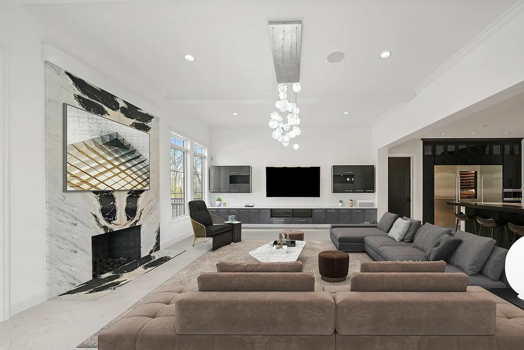The Estate in Lincolnshire offers a grand scale foyer, ebony oak floors, an open floor plan, soaring ceiling heights, custom luxury finishes throughout now available for sale. This home located at 23477 N Elm Rd, Lincolnshire, Illinois