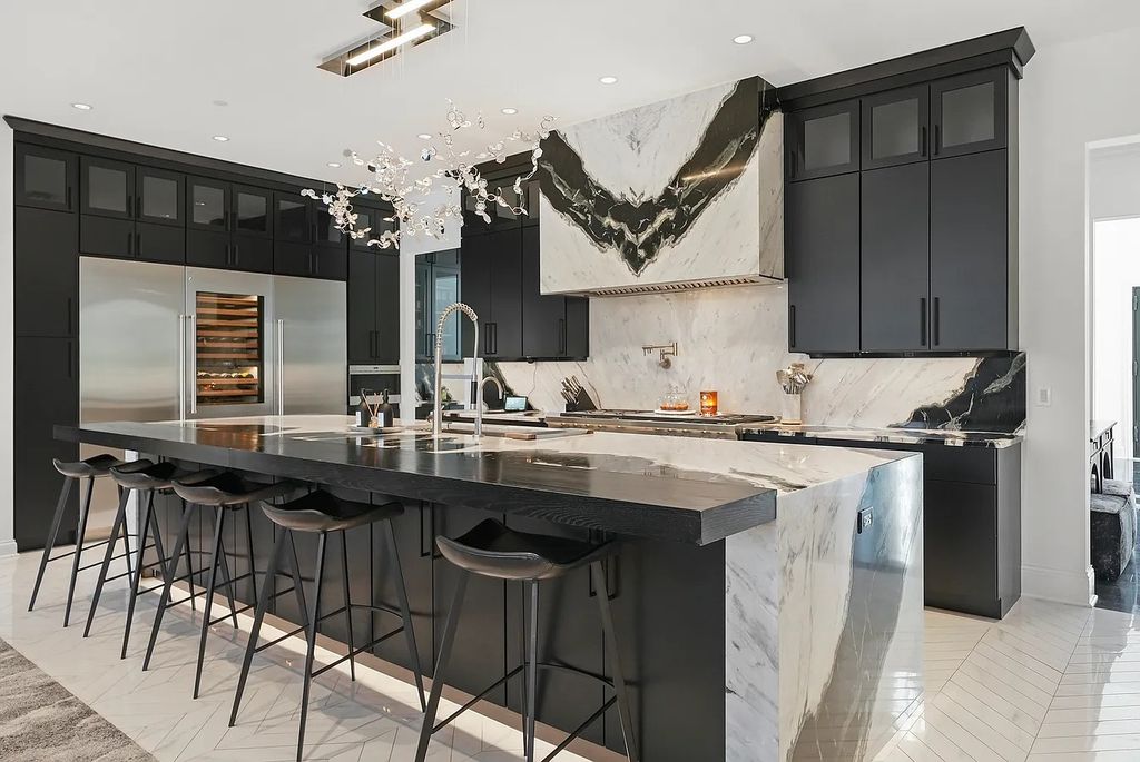 The Estate in Lincolnshire offers a grand scale foyer, ebony oak floors, an open floor plan, soaring ceiling heights, custom luxury finishes throughout now available for sale. This home located at 23477 N Elm Rd, Lincolnshire, Illinois