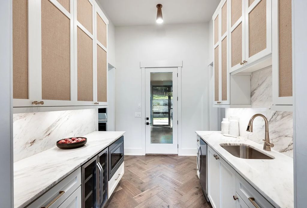 The House in Nashville has a main level master, secondary bedroom, and office along with all the elegant modern touches, now available for sale. This home located at 6523 Currywood Dr, Nashville, Tennessee