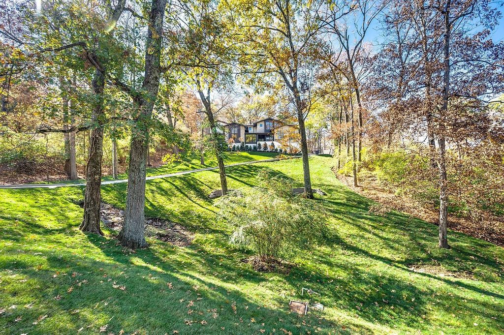 The House in Nashville has a main level master, secondary bedroom, and office along with all the elegant modern touches, now available for sale. This home located at 6523 Currywood Dr, Nashville, Tennessee