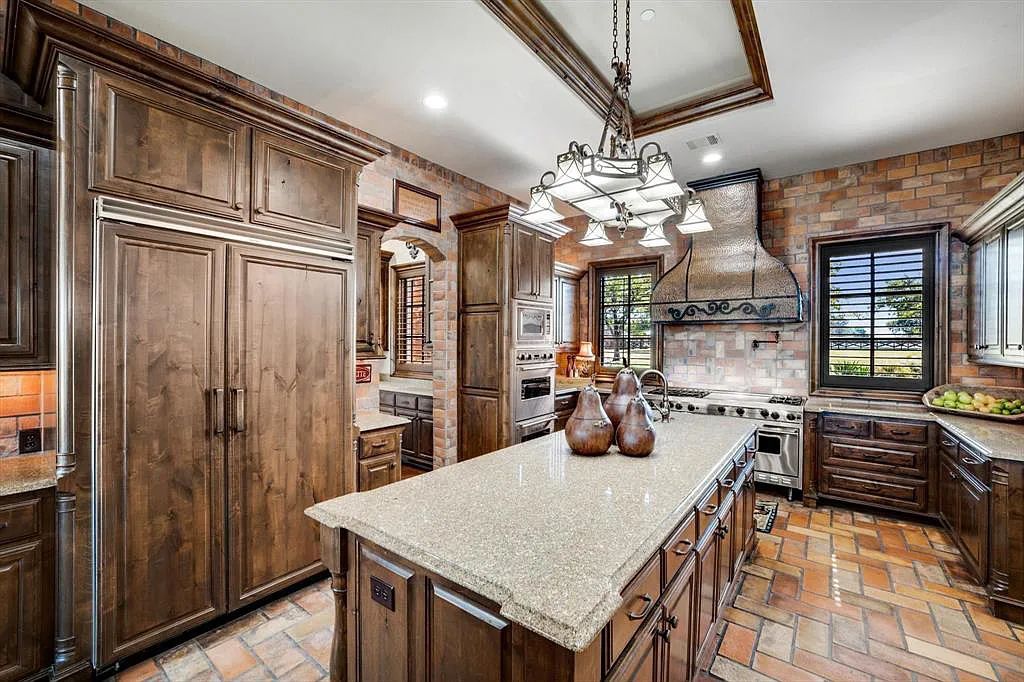 1101 E Hickory Hill Road, Argyle, Texas is a meticulous estate with amazing amenities including 4 fireplaces, climate-controlled wine room accommodates 250-300 bottles, exercise room, guest suite, game room, poker room, media room.