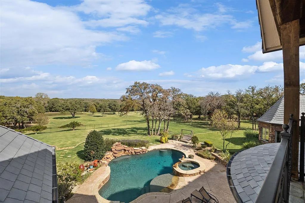 1101 E Hickory Hill Road, Argyle, Texas is a meticulous estate with amazing amenities including 4 fireplaces, climate-controlled wine room accommodates 250-300 bottles, exercise room, guest suite, game room, poker room, media room.