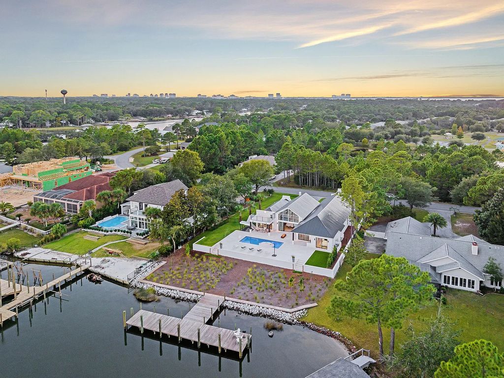 458 Shipwreck Rodd E, Santa Rosa Beach, Florida is a stunning new bayfront home boasts generous indoor and outdoor areas for entertaining, including 2,300 square feet of shell stone on the rear patio.