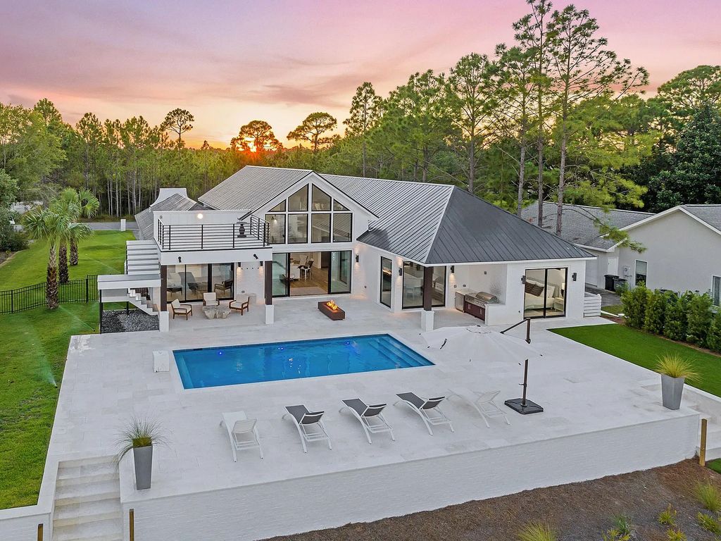 458 Shipwreck Rodd E, Santa Rosa Beach, Florida is a stunning new bayfront home boasts generous indoor and outdoor areas for entertaining, including 2,300 square feet of shell stone on the rear patio.