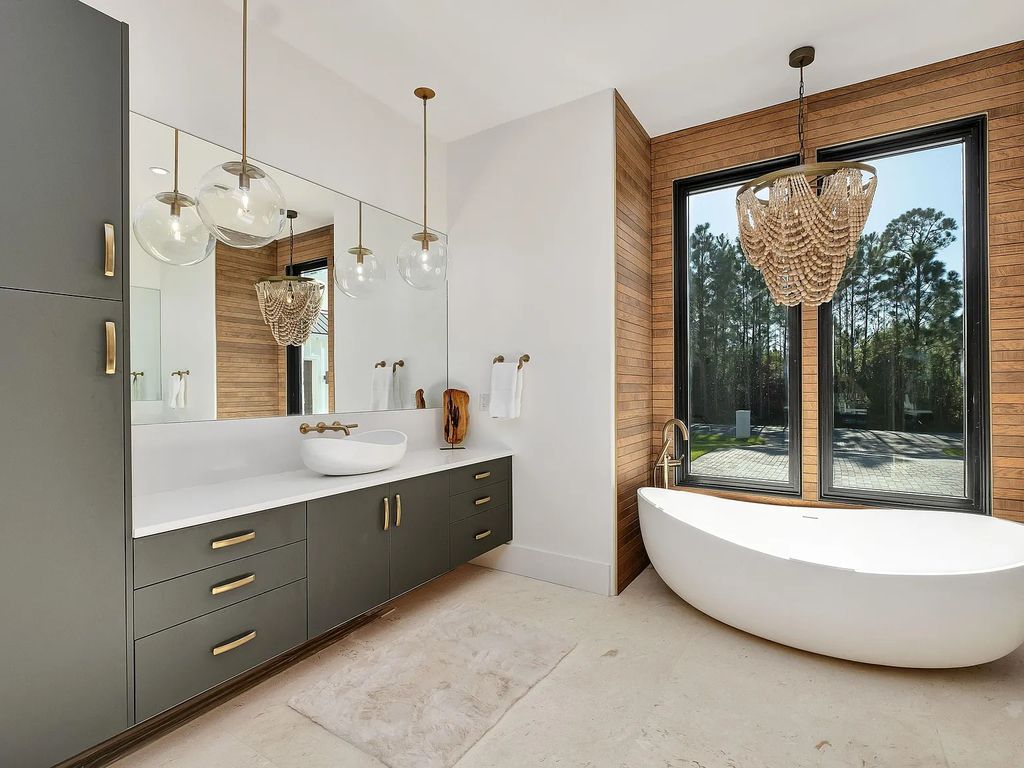 458 Shipwreck Rodd E, Santa Rosa Beach, Florida is a stunning new bayfront home boasts generous indoor and outdoor areas for entertaining, including 2,300 square feet of shell stone on the rear patio.