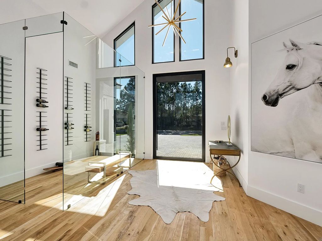 458 Shipwreck Rodd E, Santa Rosa Beach, Florida is a stunning new bayfront home boasts generous indoor and outdoor areas for entertaining, including 2,300 square feet of shell stone on the rear patio.